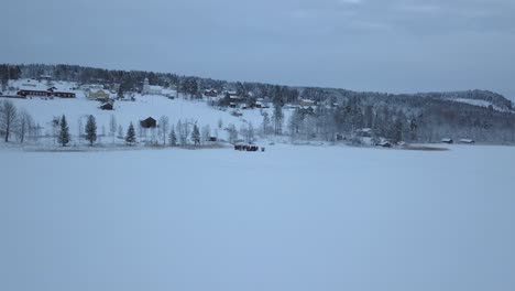 The-frozen-lake-and-forest-near-Borgvattnet,-Sweden