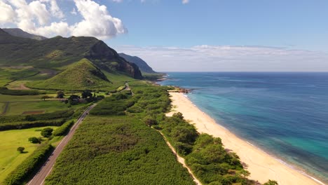 cars driving on farrington highway along the waianae coast, oahu hawaii