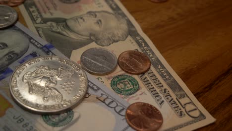 dollar bills. cash money banknotes and coins. franklin's face texture. finance and investment concept. closeup shot. currency exchange of one hundred usd. rich business economy of usa