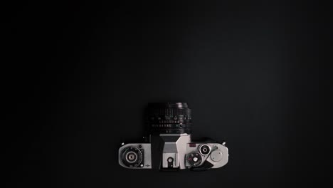 flat lay stop motion retro camera moving on surface