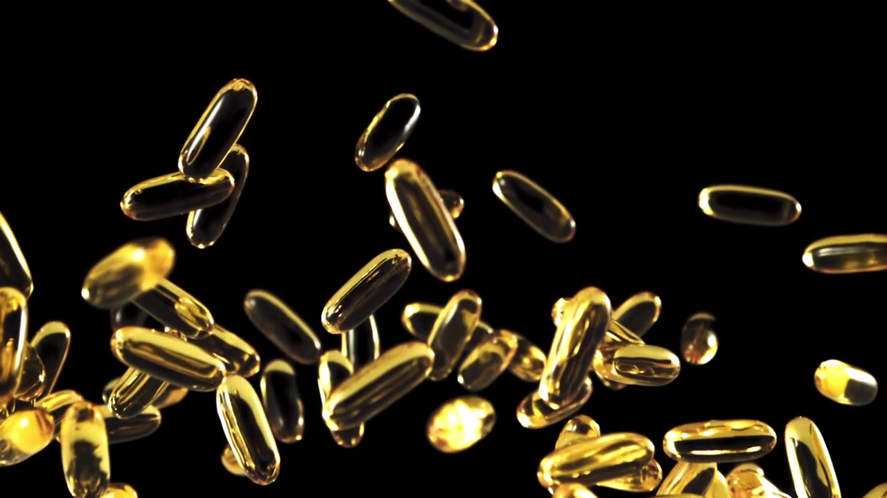 Capsule softgel dorate di Omega-3 che cadono e rimbalzano su sfondo nero.