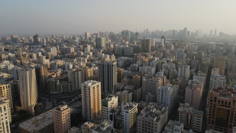 4K:-Aerial-view-of-Sharjah's-old-town-with-city-skyline,-residential-towers-in-the-United-Arab-Emirates