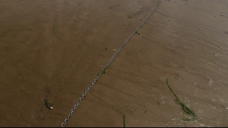 A-yacht-chained-up-on-the-beach-in-Devon