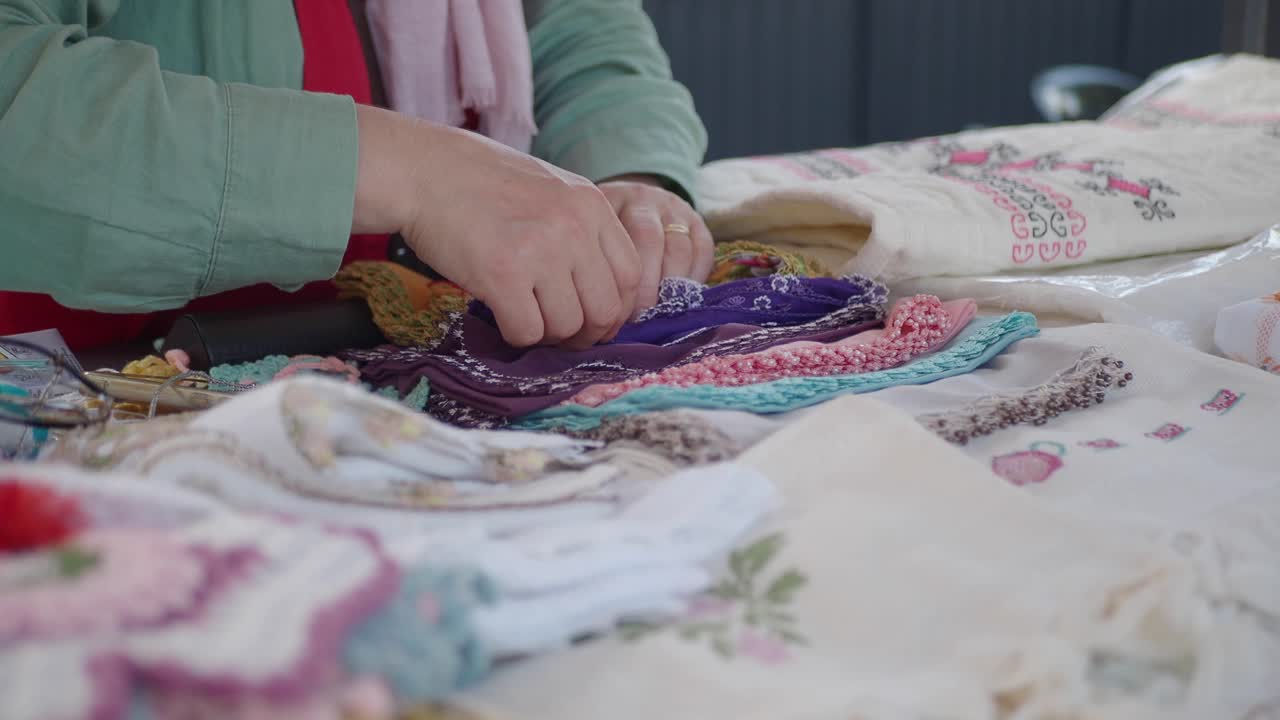 Close-up of Embroidered Handkerchiefs at a Market