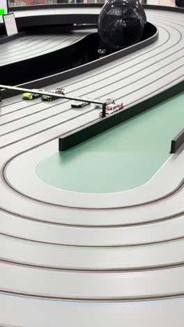 miniature cars racing on a winding track