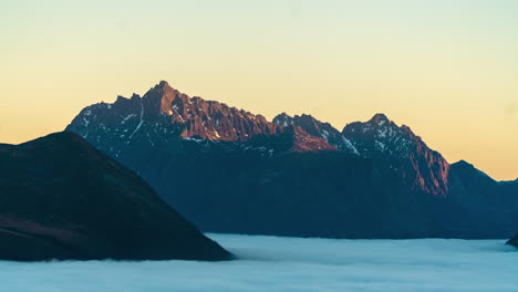 A-timelapse-of-a-mountain-right-before-sunrise-in-Ørsta,-Norway