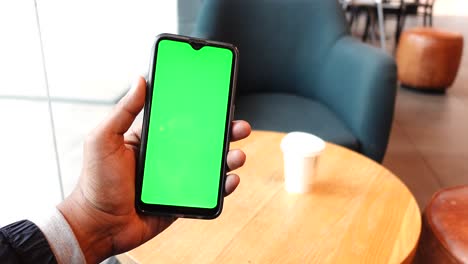 Close-up-of-young-man-hand-using-smart-phone