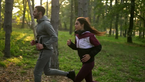 couple jogging in the forest