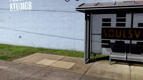 Soulsville-sign-on-bus-stop-in-Memphis,-Tennessee-with-gimbal-video-panning-left-to-right