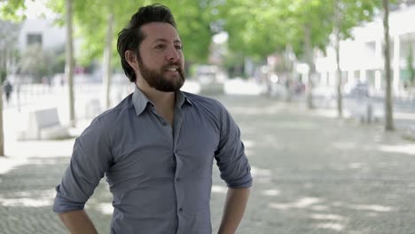 Happy-handsome-man-posing-on-street