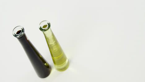 Two-bottles-of-olive-oil-and-extra-virgin-olive-oil