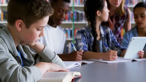 schoolkids studying in library 4k