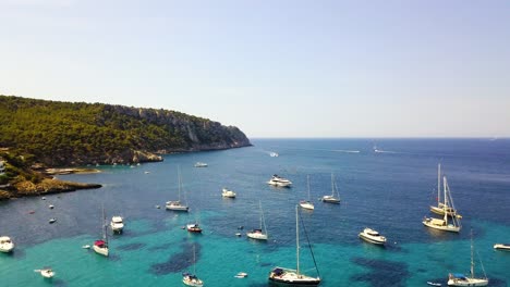 a number of boats docked in a marina off the coast of playa de san telmo, in canary islands, an autonomous island of spain located in the atlantic ocean