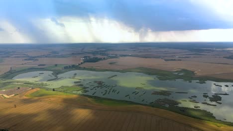 Aerial-orbit-over-the-wetlands-with-the-heavy-storm-in-distance