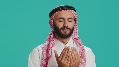 muslim person praying to allah on camera