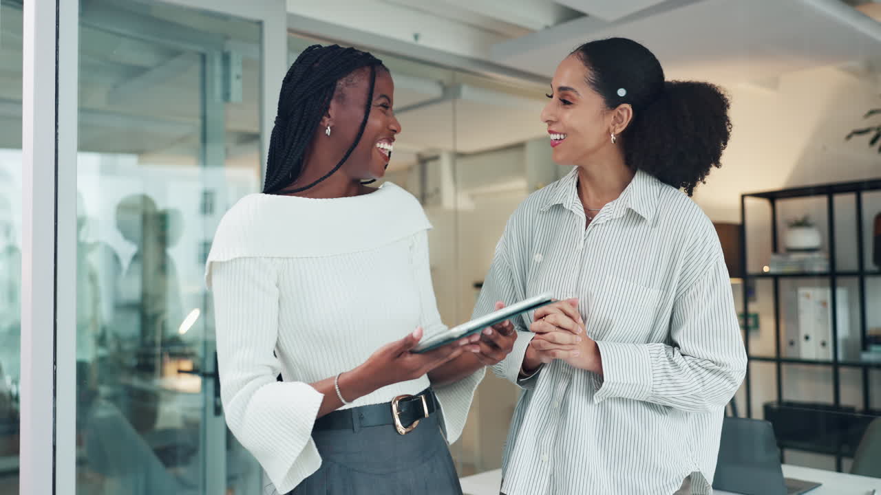 Two business women high fiving after a successful meeting