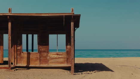 abandoned wooden hut on the beach