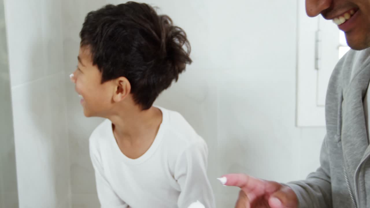 Father and son applying foam each others nose