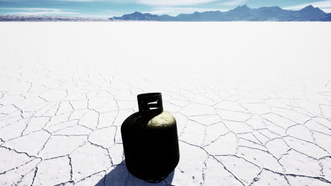 old rusted danger gas container on salt lake