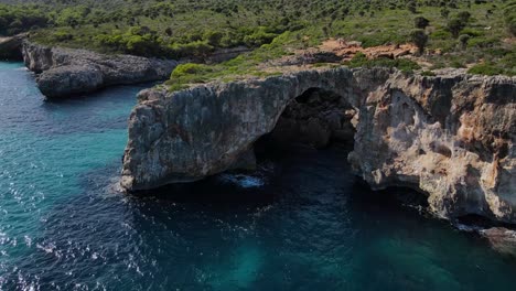 explore the stunning coastline of cala varques near porto cristo. marvel at the impressive natural arches, crystal-clear waters, and lush greenery that define this beautiful location.
