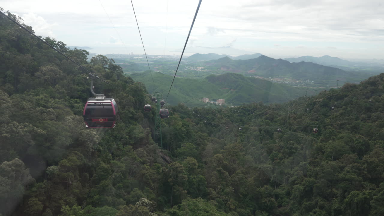 Cable car ride over lush mountainous landscape in Vietnam, stunning view