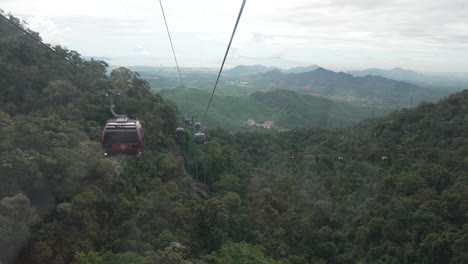 cable car ride over lush mountainous landscape in vietnam, stunning view