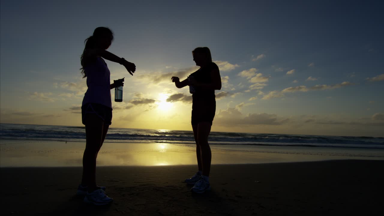 Asian Chinese girls resting before running at sunrise