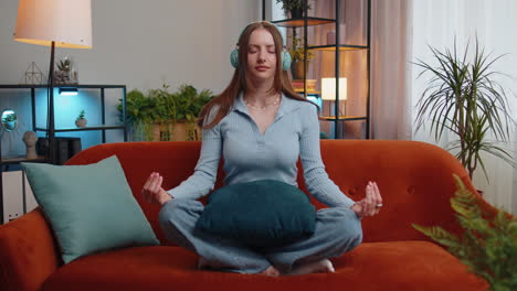 Girl-breathes-deeply-with-mudra-gesture,-eyes-closed,-meditating-with-concentrated-thoughts-peaceful