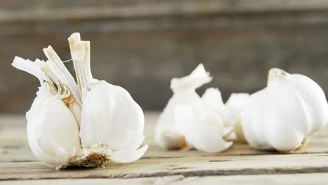 garlic on wooden table 4k
