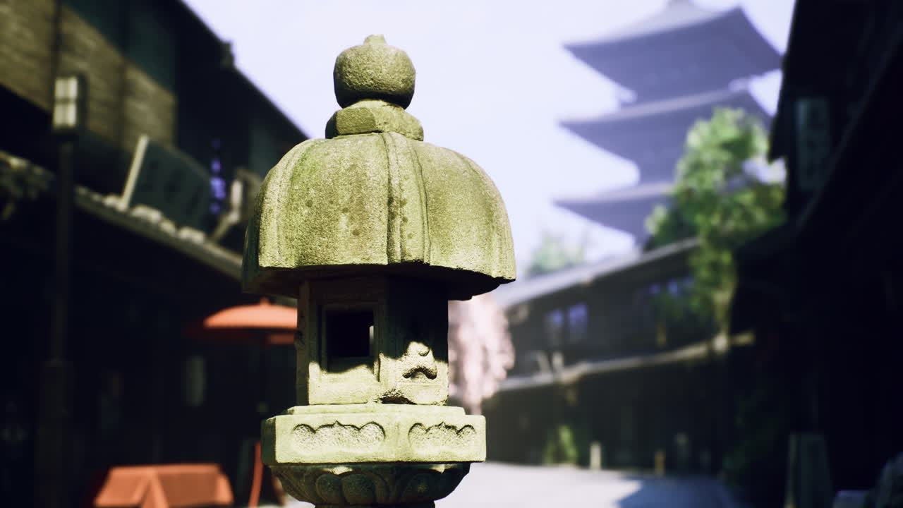 Historic stone lantern in traditional street with pagoda backdrop