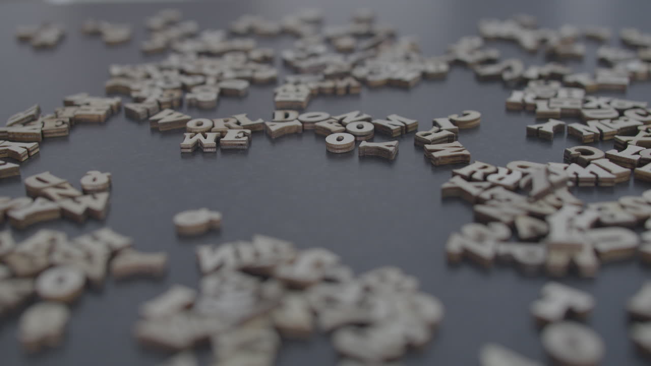 World economic forum wooden letters title blown to pieces, fake news narrative opposition protest distrust