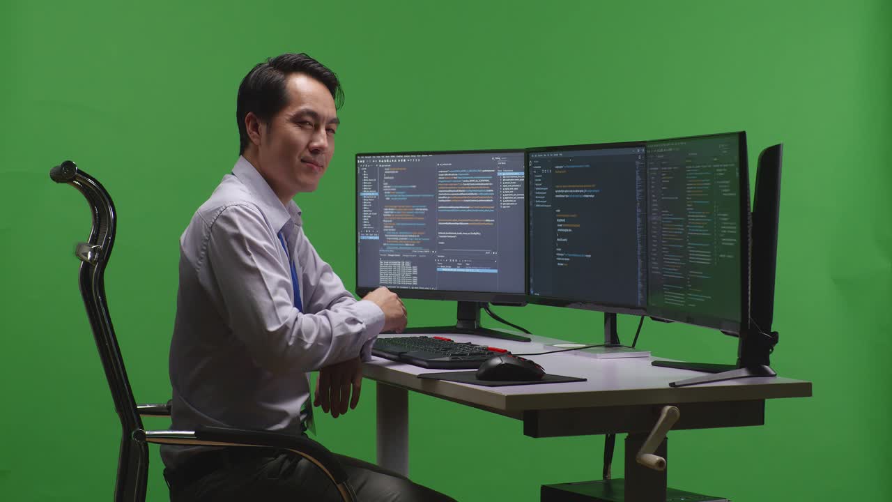 Man Programming at a Computer