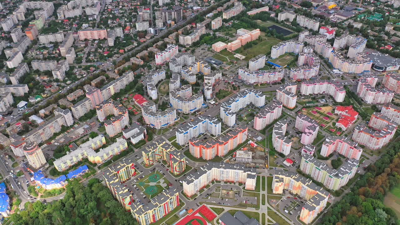 Contemporary high-rise buildings on urban background. Residential apartments for citizens in modern district. Aerial view.
