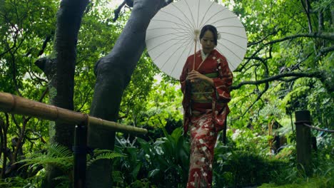 woman in traditional kimono in a japanese garden