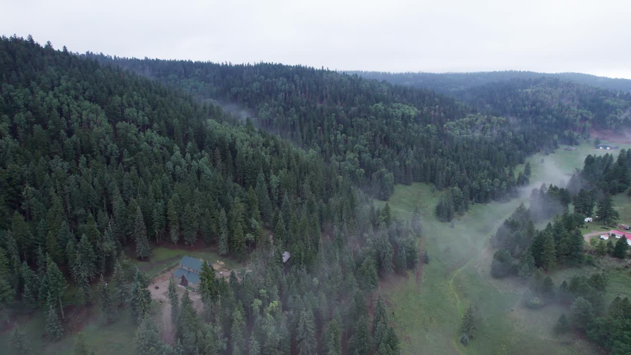 Lonely house in the foggy mountains