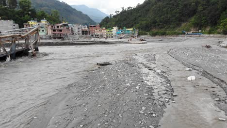 drone footage reveals severe damage in melamchi bazaar, sindhupalchok, where the melamchi river flooded due to extreme weather worsened by global warming—not just rain but rising climate stressors.