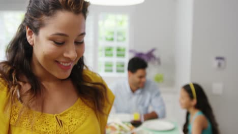 Happy-woman-holding-tray-of-food-