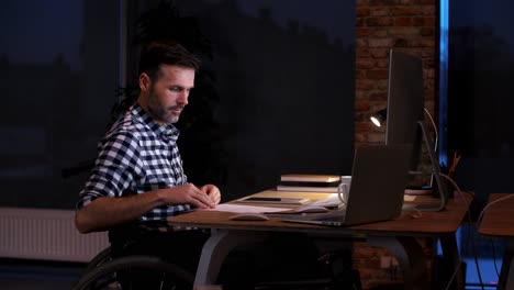 disabled man working at night