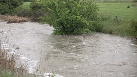 Waurn-Ponds-Creek-Geelong,-Australia-flowing-rapidly-after-large-rain-event