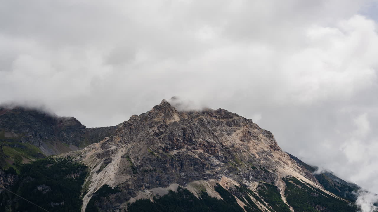 Dramatic clouds roll over Swiss Alps in serene timelapse scenery