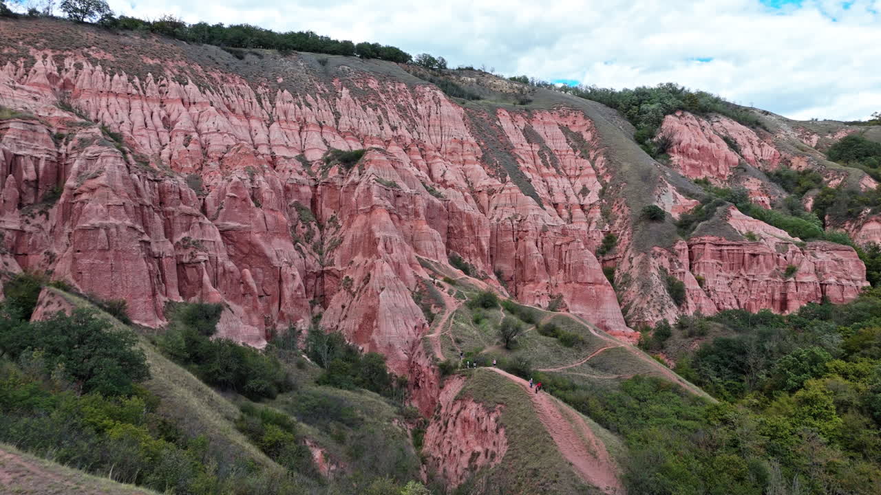 Stunning red cliffs at Râpa Roșie in a nature reserve, serene landscape