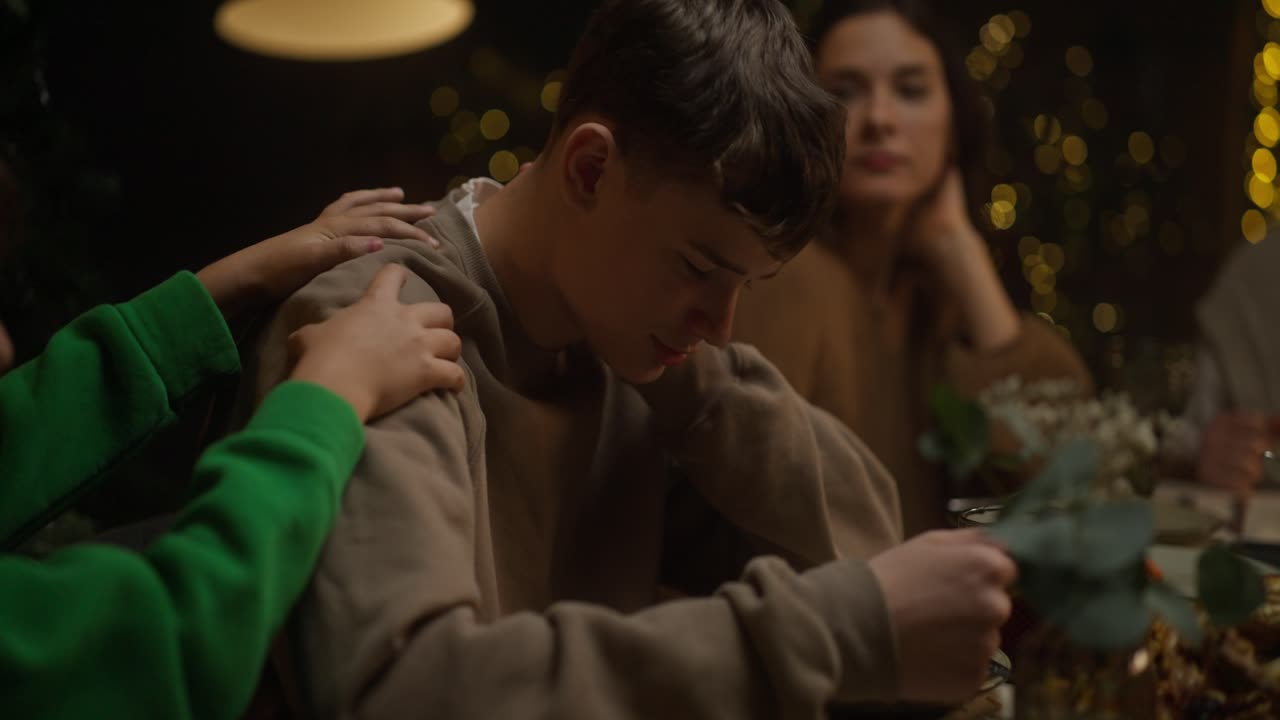 Touching moment of support and empathy within a family setting