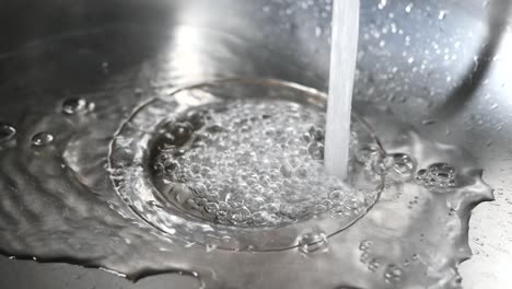 water draining into sink