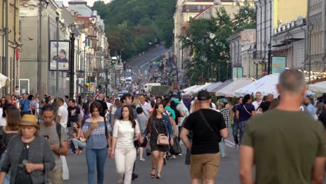 busy city street with crowds of people walking