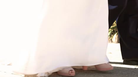 woman dressed as a bride walking on her wedding day