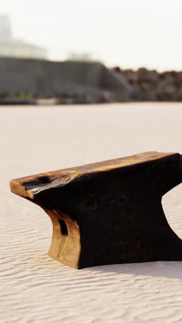 rusty anvil on a sandy beach