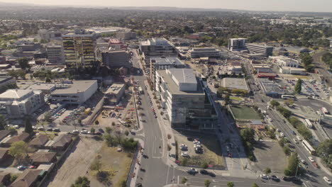 Smooth-aerial-orbit-revealing-the-heart-of-Dandenong-commercial-zone-parallel-to-the-transport-hub