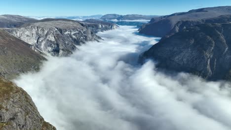 woman hiking in stunning mountain valley with clouds