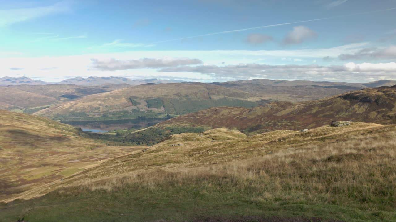Panning shot of Loch earn and highlands from the summit of Ben Vorlich