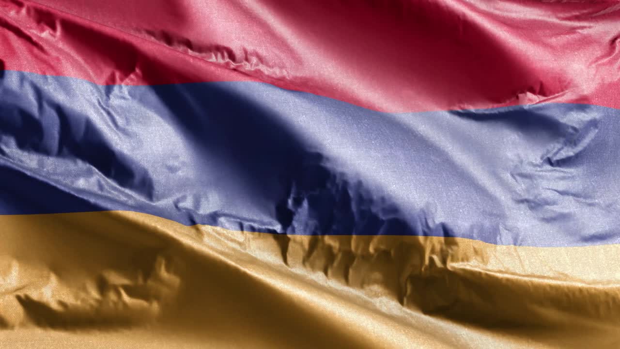 アーメニアの国旗は風の輪に振り回される アーメリアの旗は風で振り回されている 織物の織物の組織は 完全な埋め込みの背景 10秒のループ